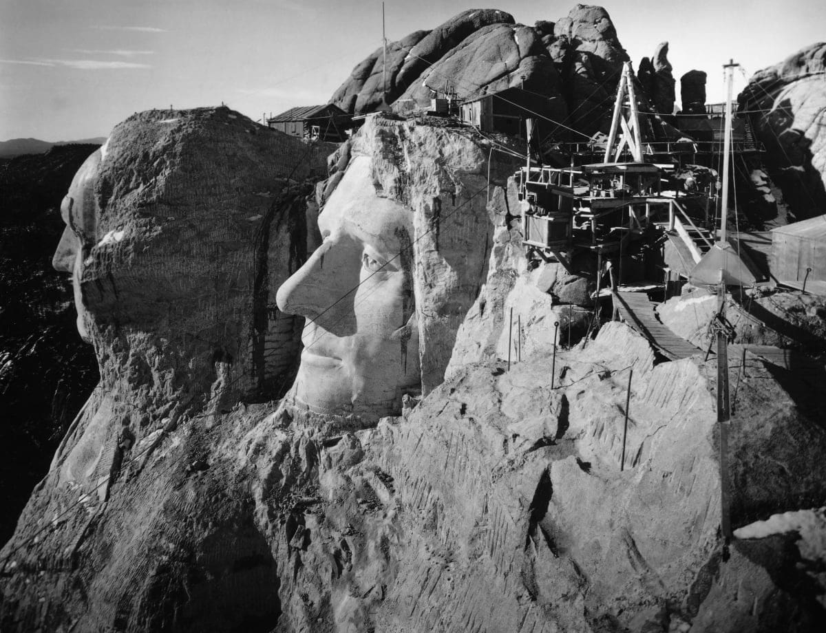Image Source: Mount Rushmore, South Dakota: The head of Washington and Jefferson from the top of Lincoln's head. Undated photograph. Ca. 1940s. (Photo by Bettman / Getty Images)