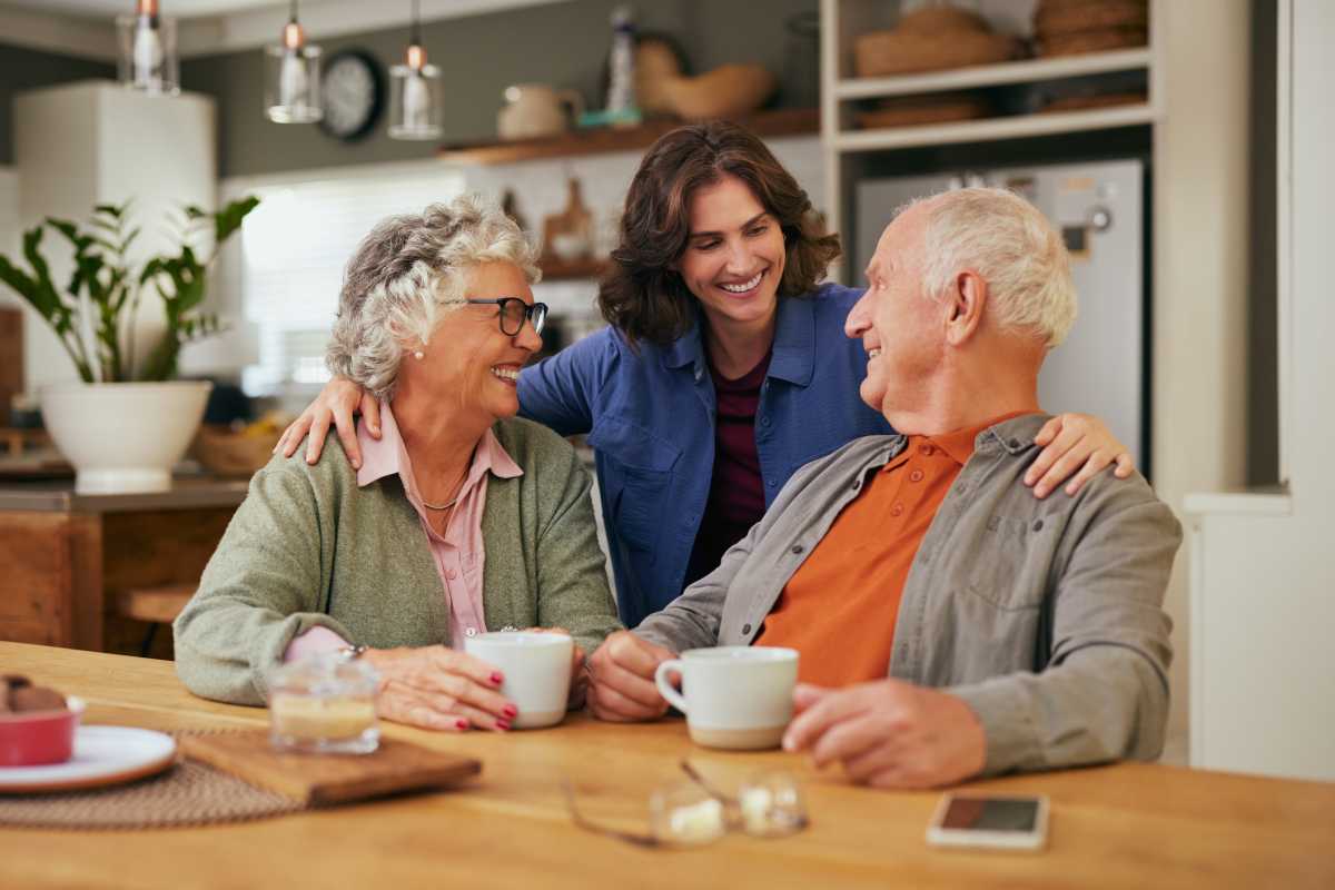 Senior father and old mother sharing tea and heartfelt conversation with daughter at home. (Representative Image Source: Getty Images | Photo by Ridofranz)