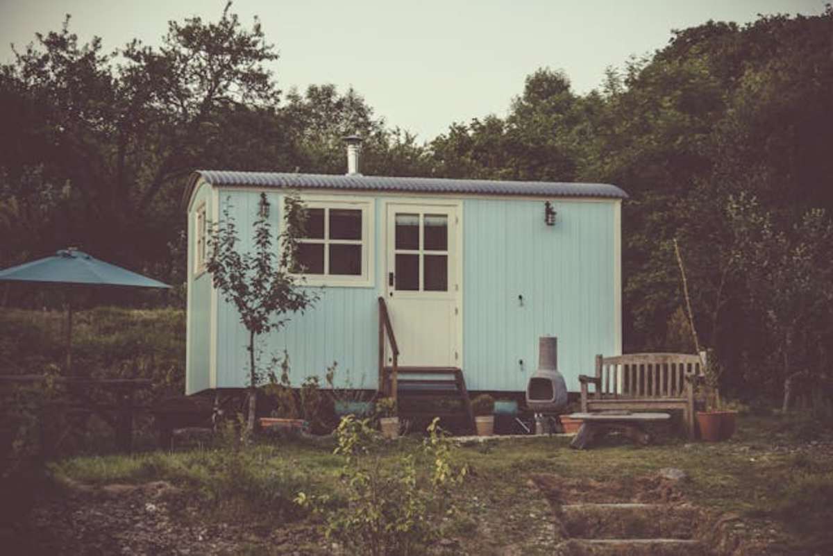 A tiny home in the middle of the woods. Representative Image Source: Pexels | James Frid