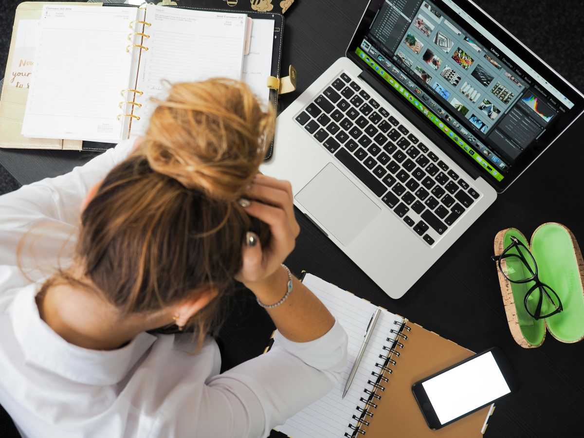 A woman stressed at work (Representative Image Source: Pexels | energepic.com)
